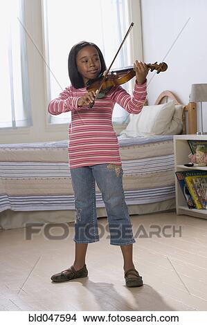 African American girl playing violin View Large Photo Image Picture - African American girl playing violin. Fotosearch