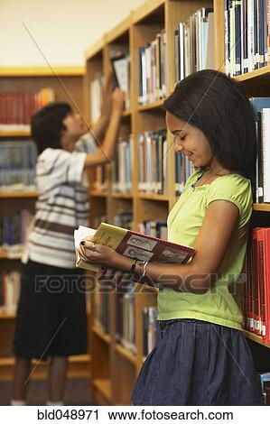 African American girl reading library book View Large Photo Image Stock Image - African American girl reading library book. Fotosearch