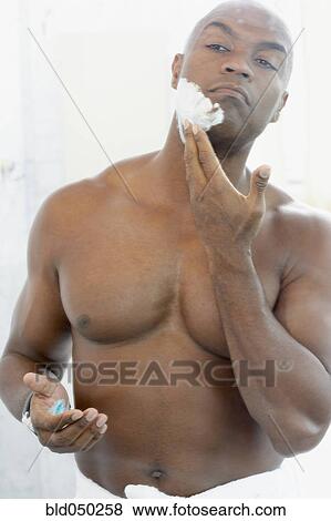 African American man applying shaving cream View Large Photo Image Stock Photo - African American man applying shaving cream. Fotosearch