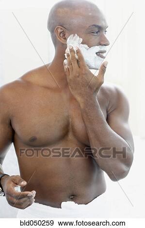 African American man applying shaving cream View Large Photo Image Stock Photo - African American man applying shaving cream. Fotosearch