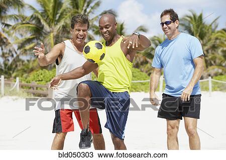 African American man bouncing soccer ball on knee View Large Photo Image Stock Image - African American man bouncing soccer ball on knee. Fotosearch