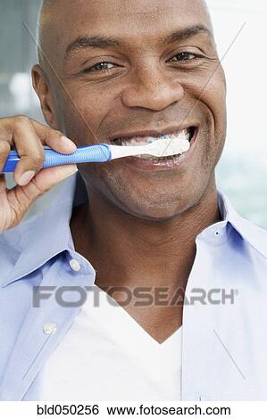 African American man brushing teeth View Large Photo Image Stock Photograph - African American man brushing teeth. Fotosearch