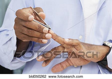 African American man clipping fingernails View Large Photo Image Stock Image - African American man clipping fingernails. Fotosearch