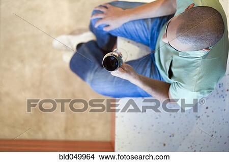 Picture - African American man drinking wine. Fotosearch