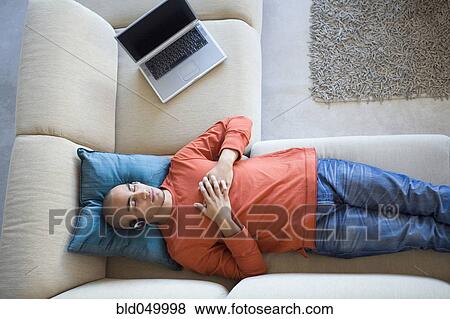 Stock Photo - African American man listening to headphones. Fotosearch