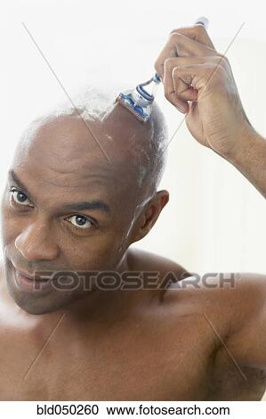 African American man shaving head View Large Photo Image Stock Image - African American man shaving head. Fotosearch