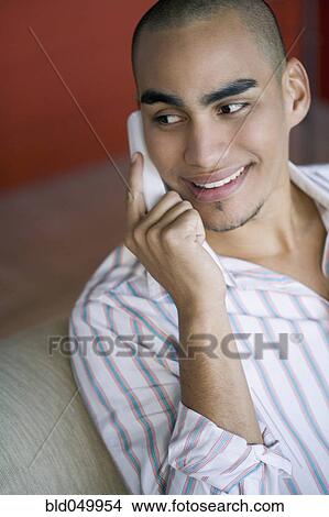 African American man taking on telephone View Large Photo Image Picture - African American man taking on telephone. Fotosearch