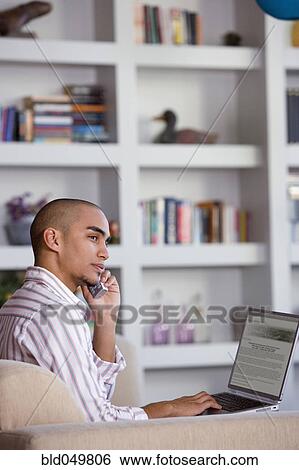 African American man talking on cell phone View Large Photo Image Stock Photograph - African American man talking on cell phone. Fotosearch
