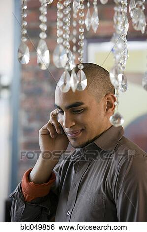 African American man talking on cell phone View Large Photo Image Stock Photograph - African American man talking on cell phone. Fotosearch