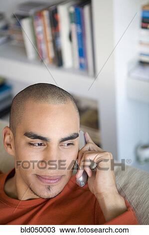 Stock Image - African American man talking on telephone. Fotosearch