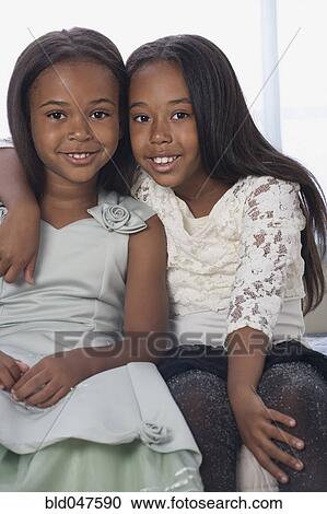 African American sisters hugging View Large Photo Image Stock Image - African American sisters hugging. Fotosearch