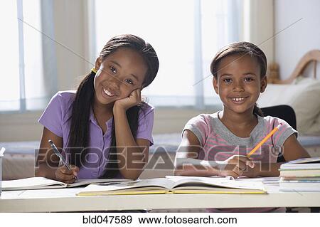 African American sisters studying View Large Photo Image Stock Photo - African American sisters studying. Fotosearch