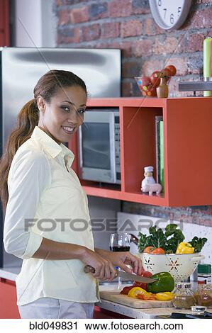 African American woman chopping vegetables View Large Photo Image Stock Image - African American woman chopping vegetables. Fotosearch