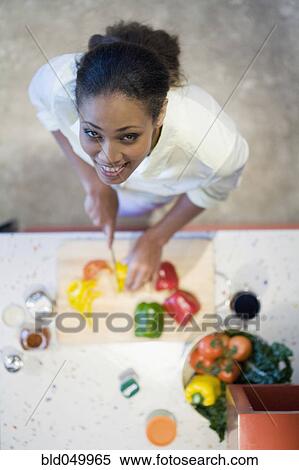 African American woman chopping vegetables View Large Photo Image Stock Photography - African American woman chopping vegetables. Fotosearch