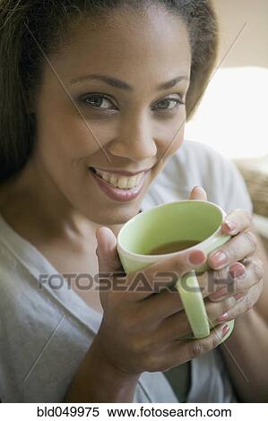 African American woman drinking coffee View Large Photo Image Stock Photography - African American woman drinking coffee. Fotosearch
