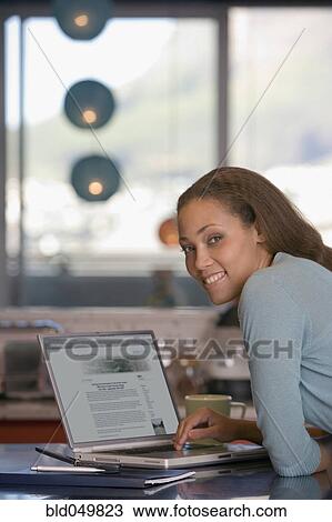 African American woman next to laptop View Large Photo Image Stock Image - African American woman next to laptop. Fotosearch