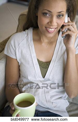 African American woman talking on telephone View Large Photo Image Stock Photo - African American woman talking on telephone. Fotosearch