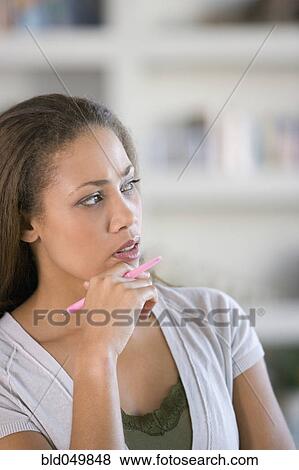 Stock Photo - African American woman thinking. Fotosearch