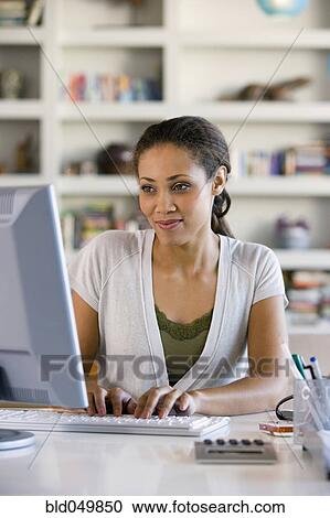 African American woman typing on computer View Large Photo Image Stock Image - African American woman typing on computer. Fotosearch