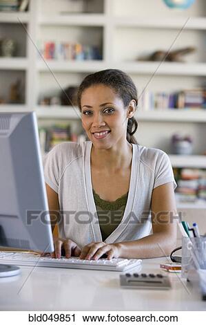 African American woman typing on computer View Large Photo Image Stock Image - African American woman typing on computer. Fotosearch