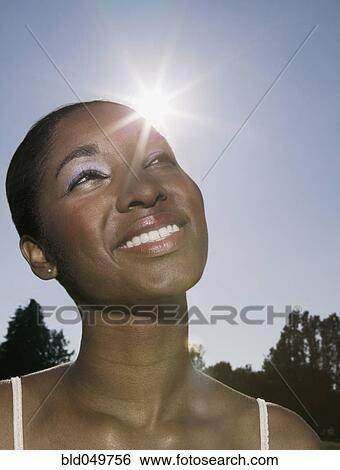 African woman looking up View Large Photo Image Stock Photograph - African woman looking up. Fotosearch