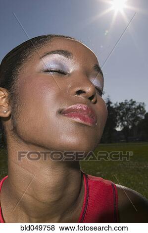 African woman with eyes closed View Large Photo Image Stock Photo - African woman with eyes closed. Fotosearch