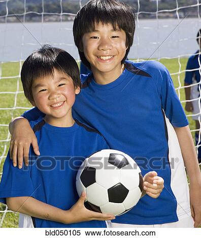 Asian boys with soccer ball View Large Photo Image Stock Photography - Asian boys with soccer ball. Fotosearch