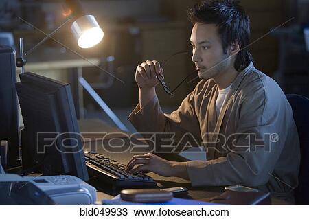 Asian businessman typing on computer View Large Photo Image Stock Image - Asian businessman typing on computer. Fotosearch