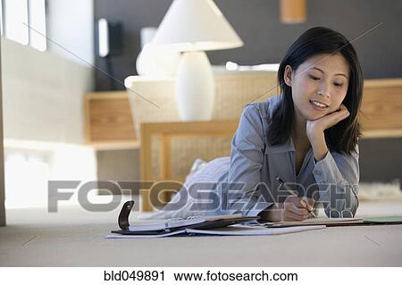 Asian businesswoman working on floor View Large Photo Image Stock Image - Asian businesswoman working on floor. Fotosearch