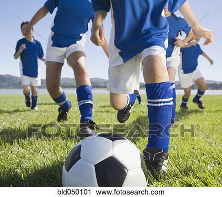 Asian children playing soccer View Large Photo Image Stock Image - Asian children playing soccer. Fotosearch