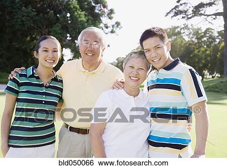 Asian family hugging View Large Photo Image Stock Photograph - Asian family hugging. Fotosearch