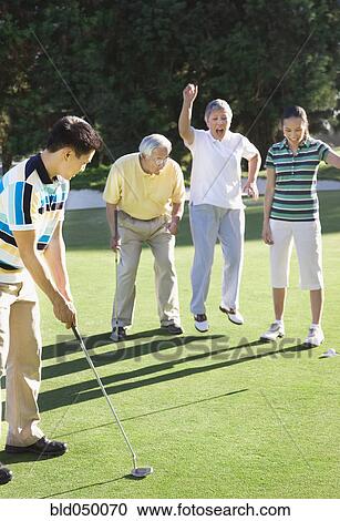 Asian man playing golf View Large Photo Image Stock Image - Asian man playing golf. Fotosearch
