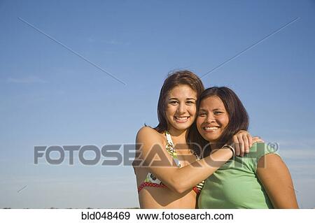 Asian mother and daughter hugging View Large Photo Image Stock Photo - Asian mother and daughter hugging. Fotosearch