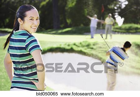 Asian woman on golf course View Large Photo Image Stock Photography - Asian woman on golf course. Fotosearch