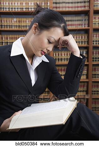 Asian woman reading library reference book View Large Photo Image Picture - Asian woman reading library reference book. Fotosearch