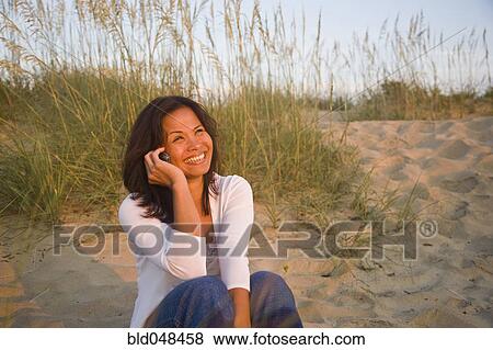 Asian woman talking on cell phone View Large Photo Image Stock Photo - Asian woman talking on cell phone. Fotosearch