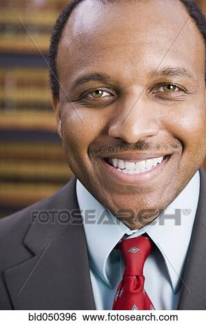 Close up of African American businessman smiling View Large Photo Image Stock Photograph - Close up of African American businessman smiling. Fotosearch