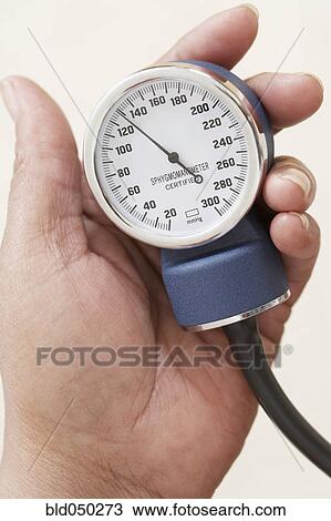Stock Image - Close up of blood pressure gauge. Fotosearch