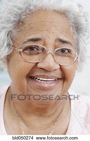 Picture - Close up of senior African American woman smiling. Fotosearch
