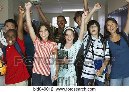 Stock Image - Group of multi-ethnic students cheering. Fotosearch