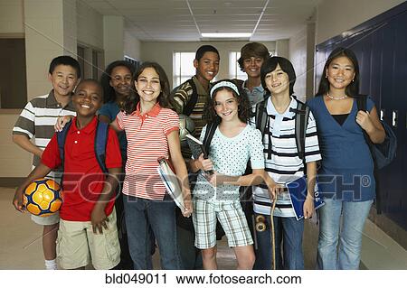 Stock Image - Group of multi-ethnic students in hallway. Fotosearch