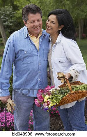 Hispanic couple gardening View Large Photo Image Stock Photograph - Hispanic couple gardening. Fotosearch