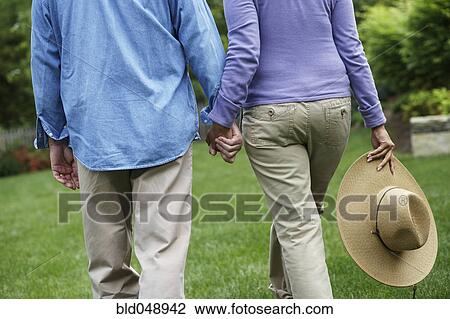 Hispanic couple holding hands View Large Photo Image Stock Image - Hispanic couple holding hands. Fotosearch