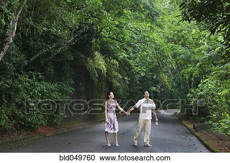 Hispanic couple holding hands View Large Photo Image Stock Image - Hispanic couple holding hands. Fotosearch