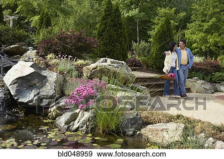 Stock Photo - Hispanic couple in garden. Fotosearch