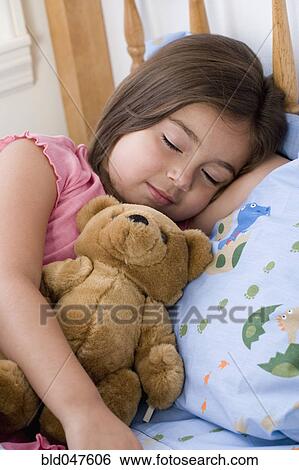 Hispanic girl sleeping with teddy bear View Large Photo Image Stock Photograph - Hispanic girl sleeping with teddy bear. Fotosearch