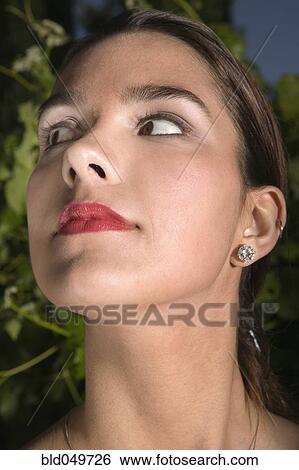Stock Photograph - Hispanic woman looking sideways. Fotosearch