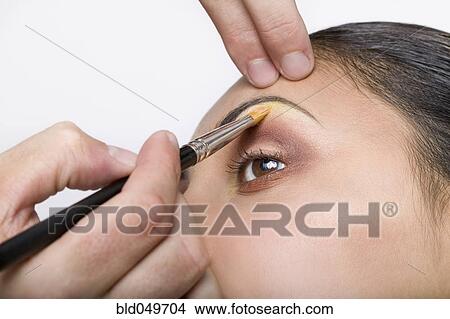 Indian woman having makeup applied View Large Photo Image Picture - Indian woman having makeup applied. Fotosearch