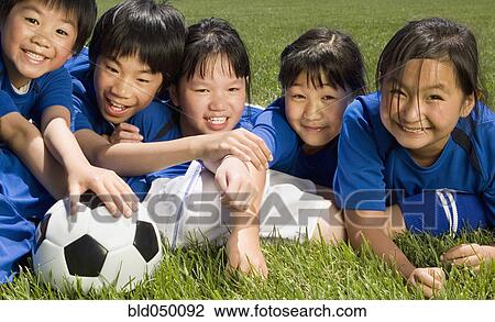 Multi-ethnic children with soccer ball View Large Photo Image Stock Image - Multi-ethnic children with soccer ball. Fotosearch