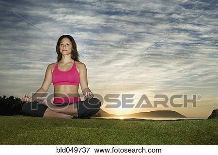 Stock Photo - Pacific Islander woman meditating. Fotosearch